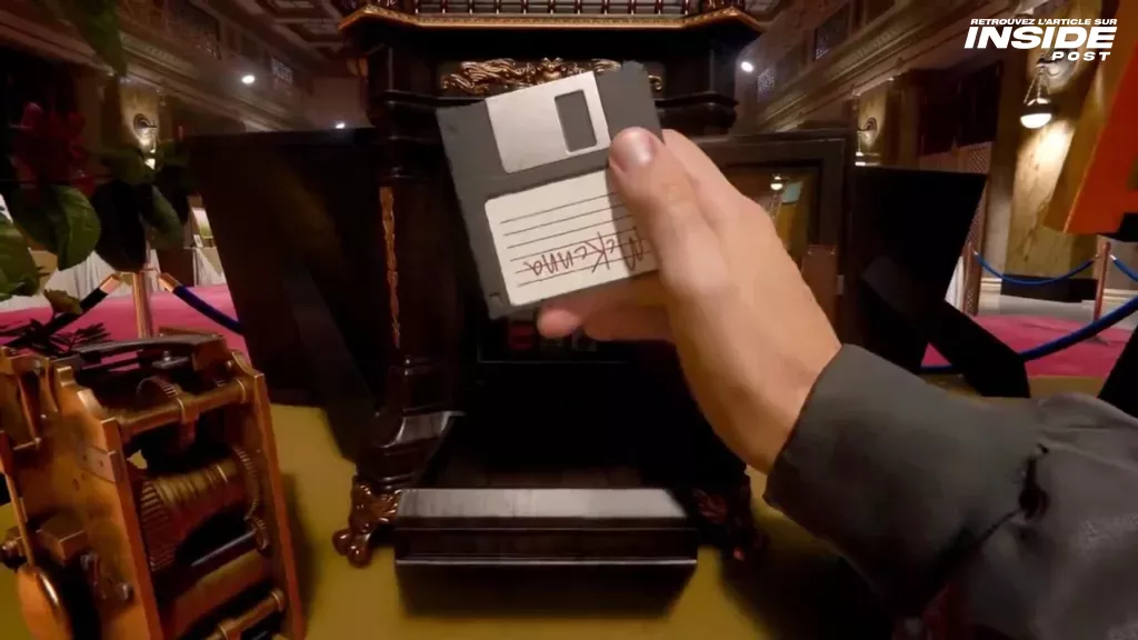 Scene from the trailer showing a floppy disk in the player's hand with the inscription 'McKenna'.